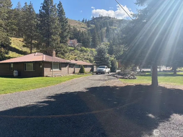 a view of house with yard and street view