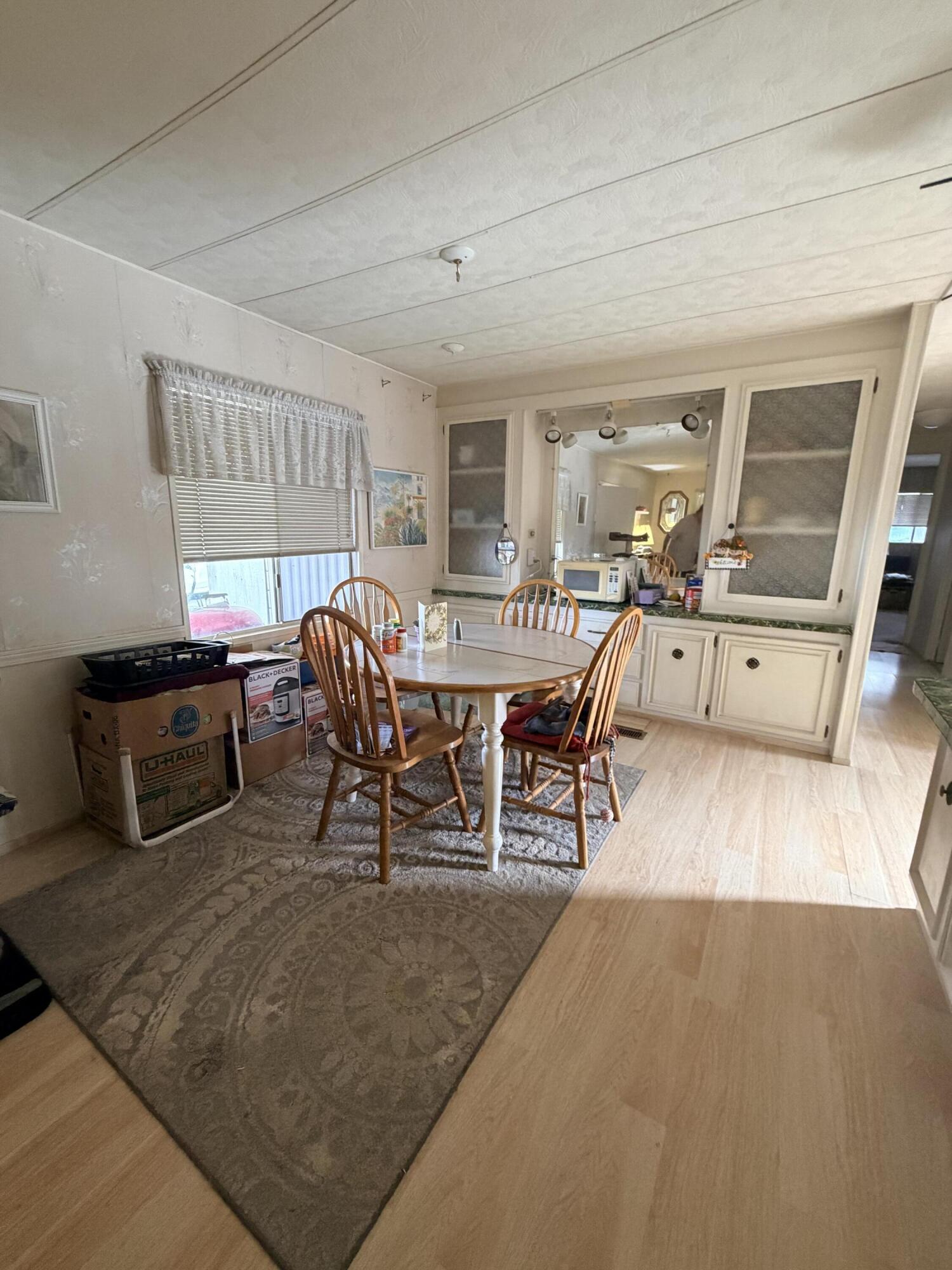 288 Turf Paradise Street Rancho Mirage, CA 92270 - Photo 1 of 18 a living room with furniture a window and wooden floor