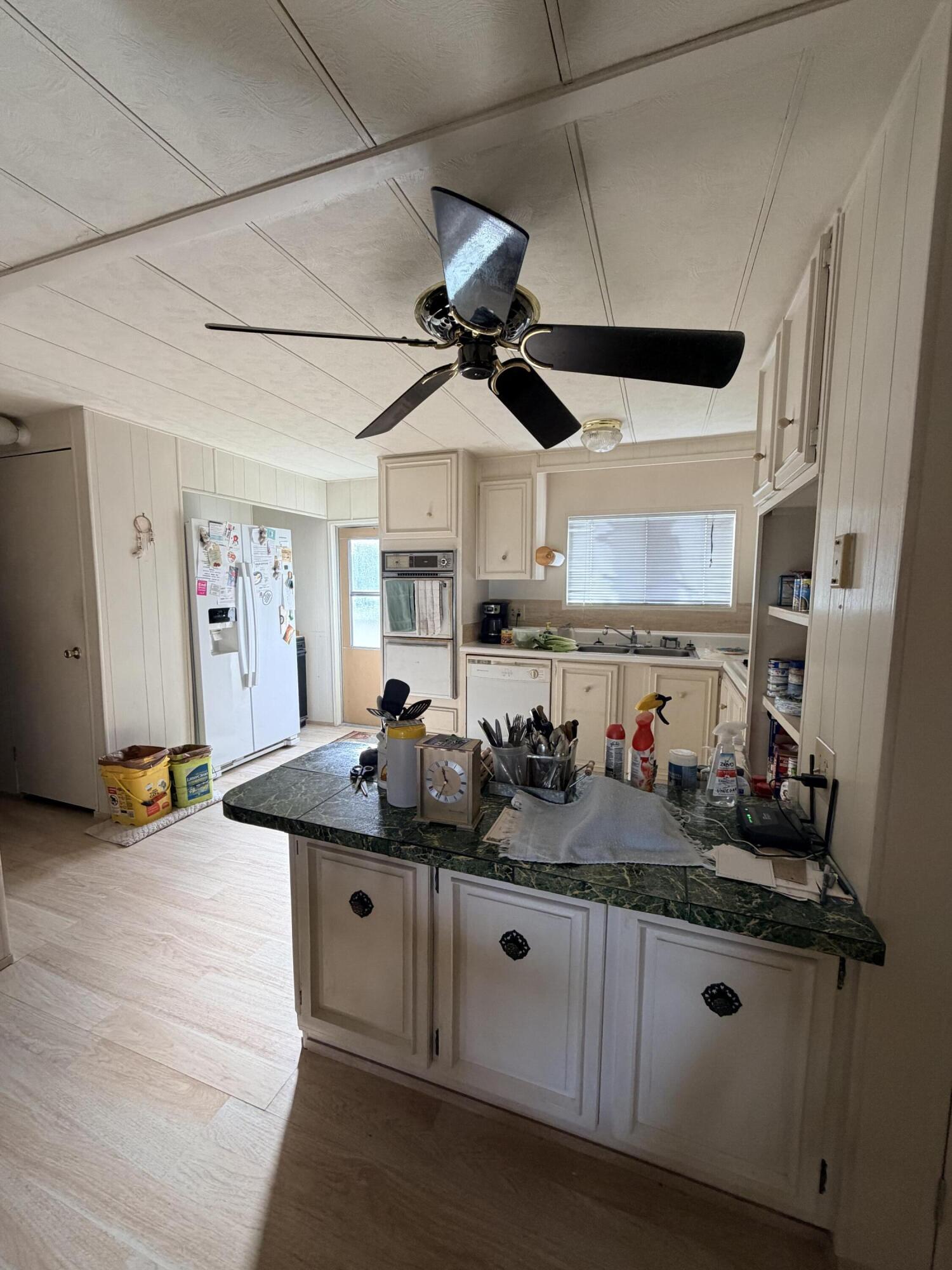 288 Turf Paradise Street Rancho Mirage, CA 92270 - Photo 12 of 18 a kitchen with sink and cabinets