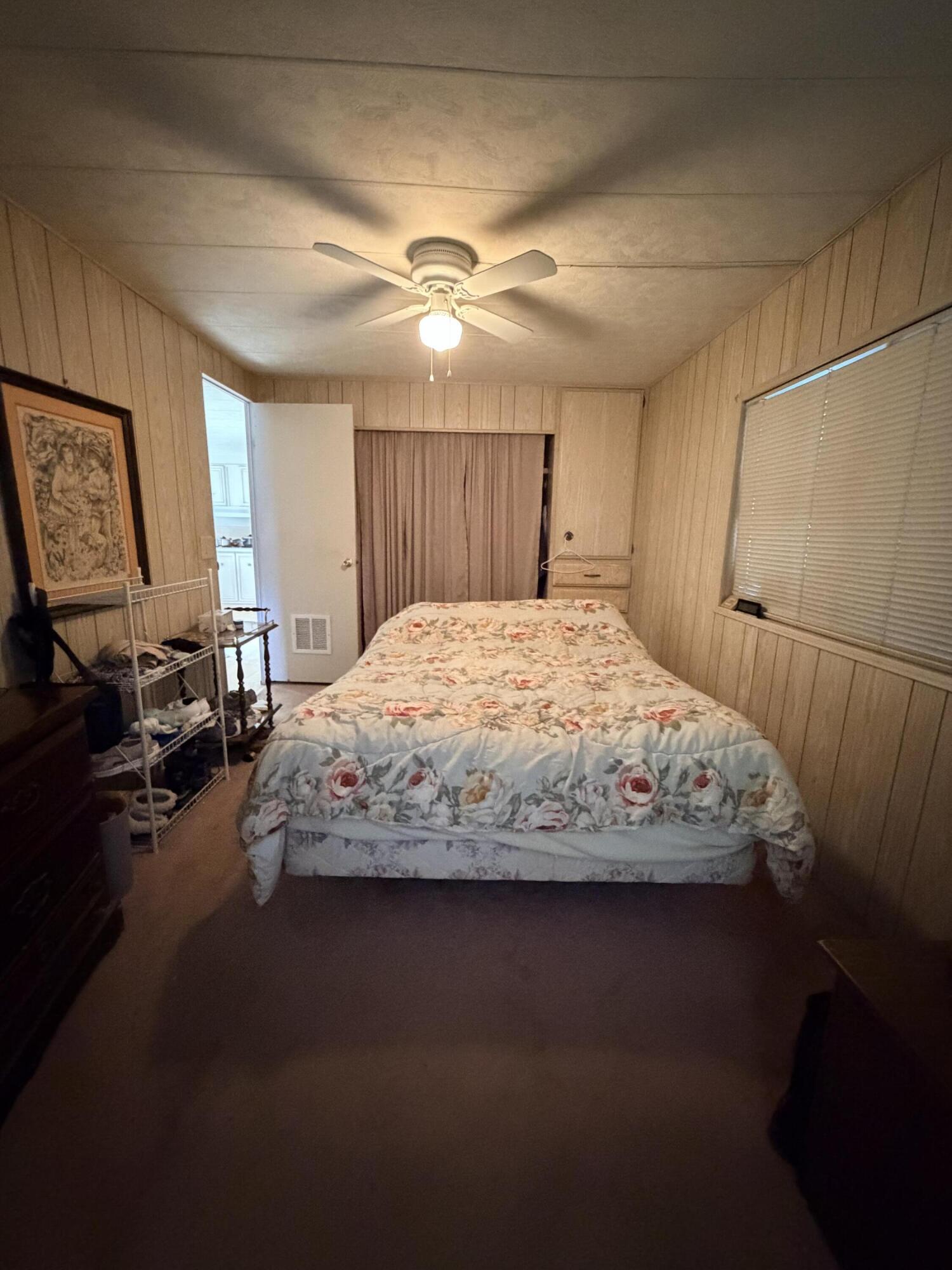 288 Turf Paradise Street Rancho Mirage, CA 92270 - Photo 15 of 18 a bedroom with a large bed and wooden floor