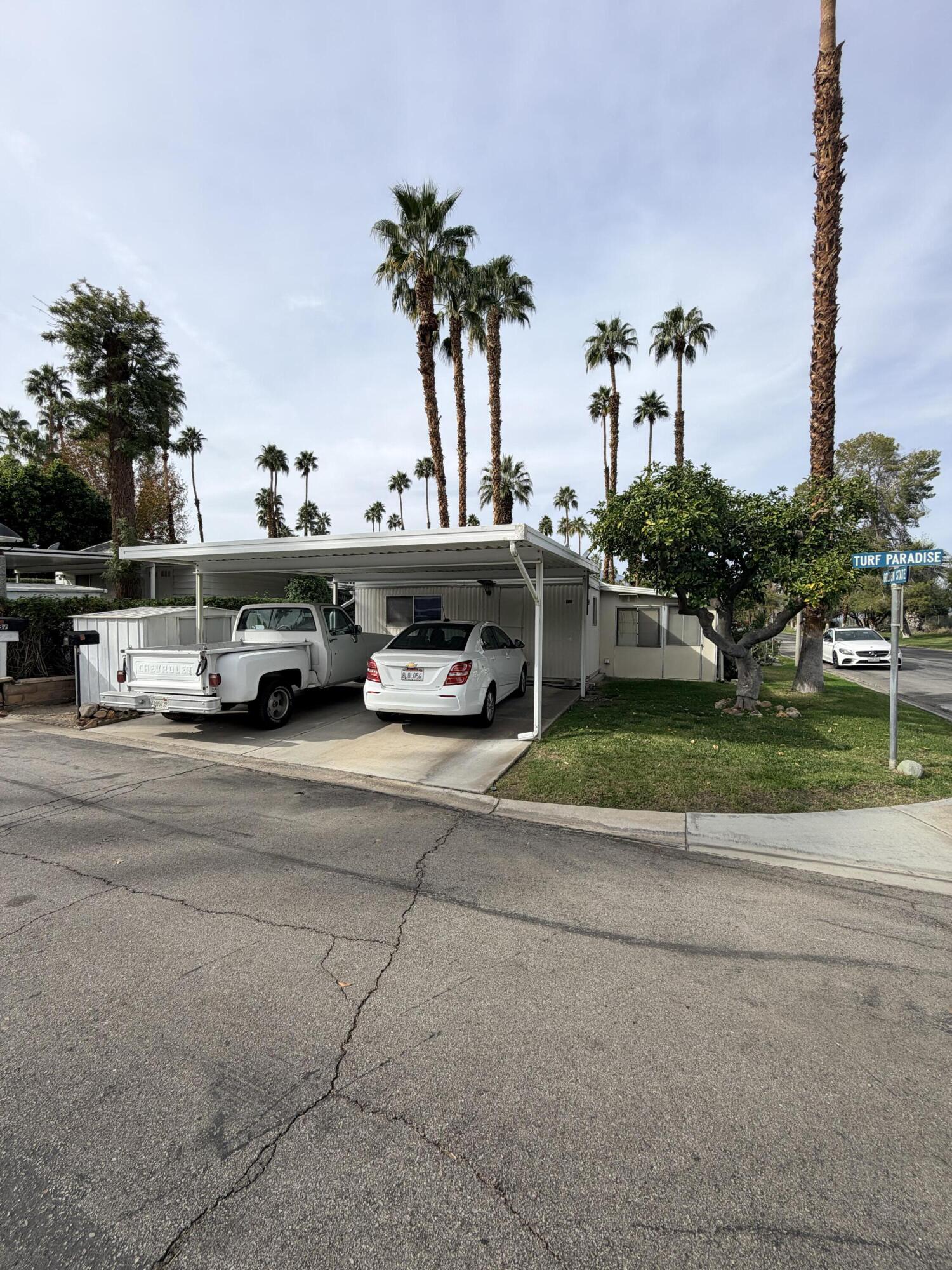 288 Turf Paradise Street Rancho Mirage, CA 92270 - Photo 5 of 18 a car parked on the side of the road