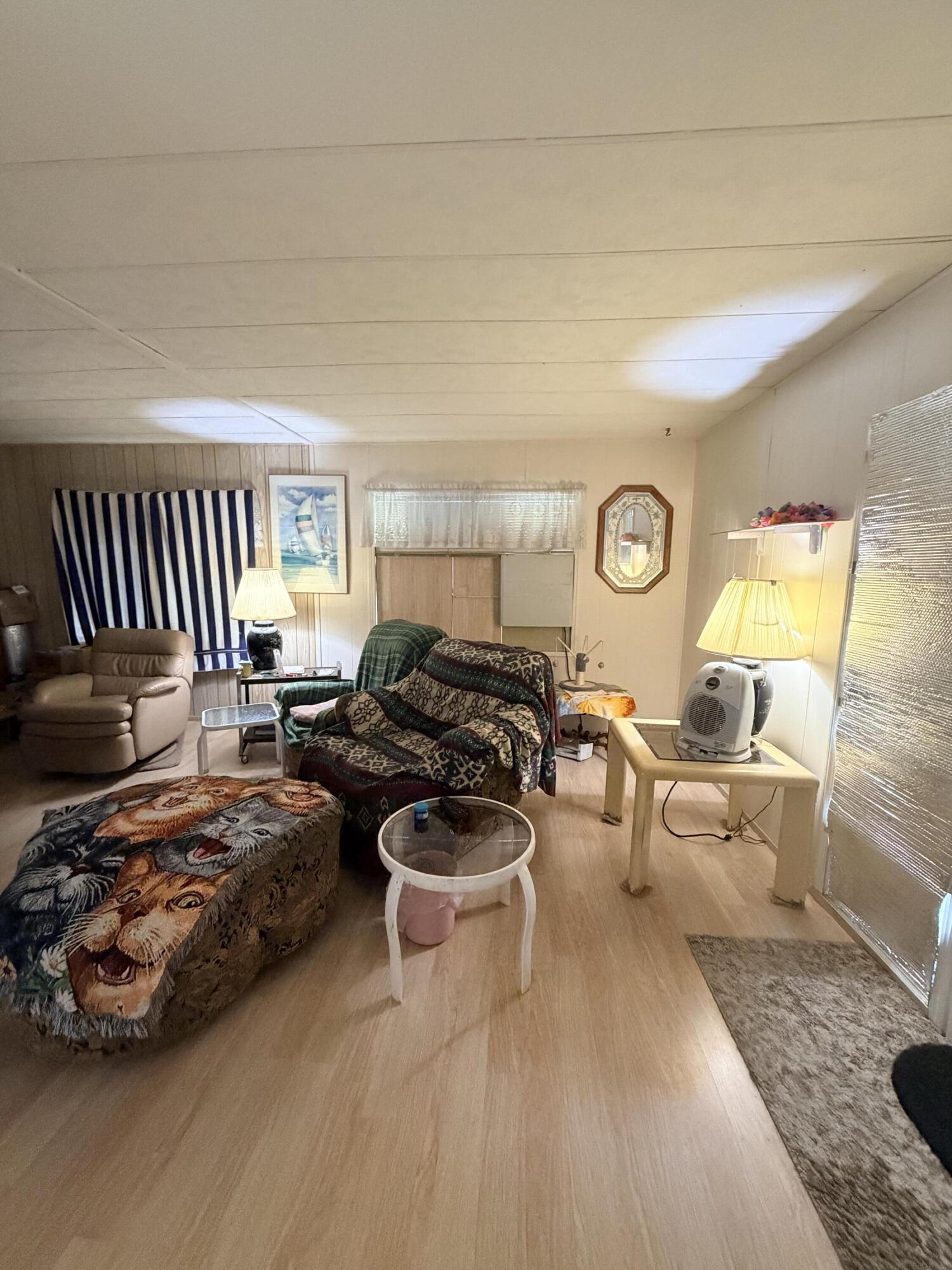 288 Turf Paradise Street Rancho Mirage, CA 92270 - Photo 10 of 18 a bedroom with furniture and a wooden floor