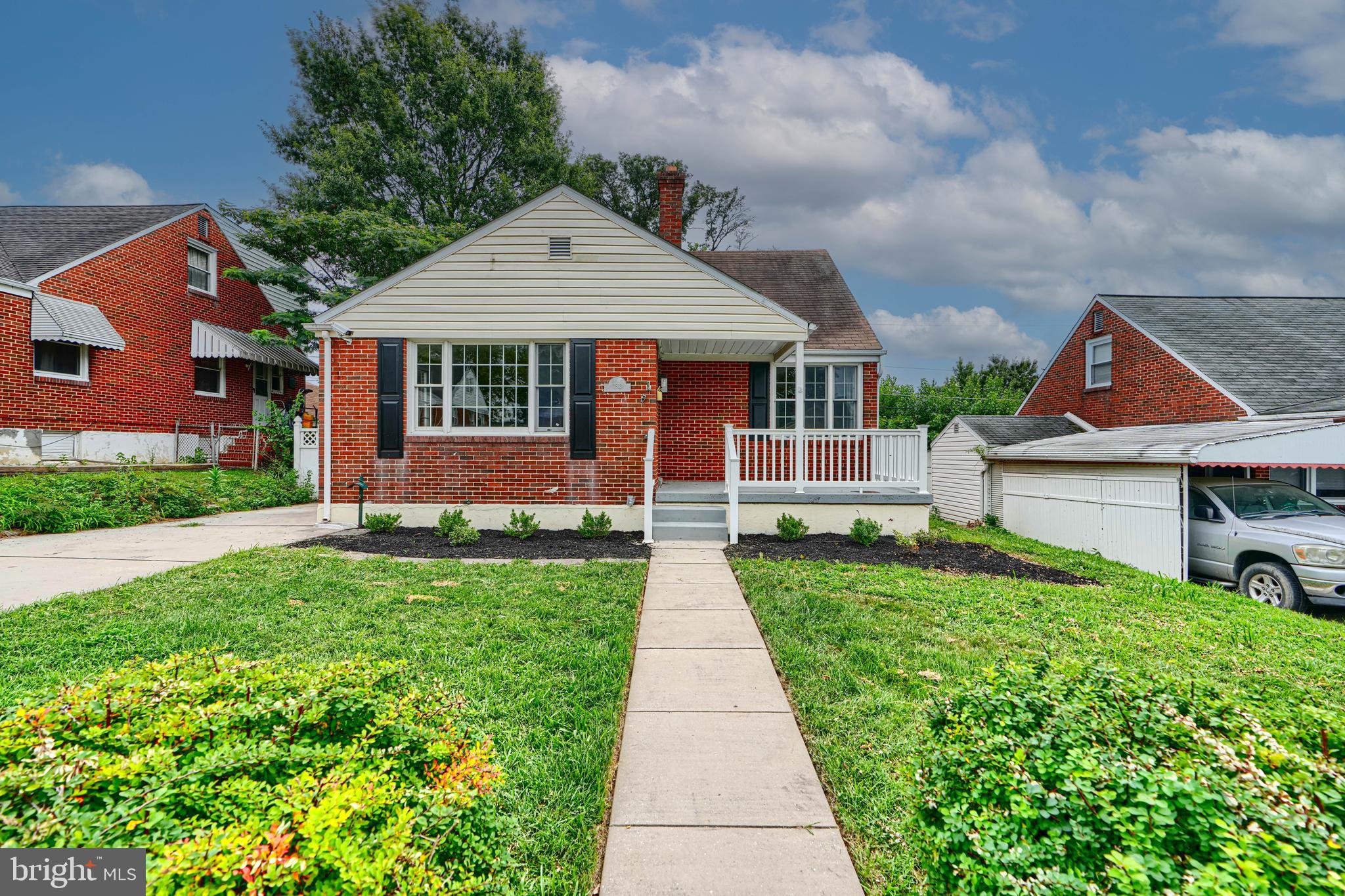 1813 Weyburn Road Baltimore, MD 21237 - Photo 1 of 39 front view of a house with a yard