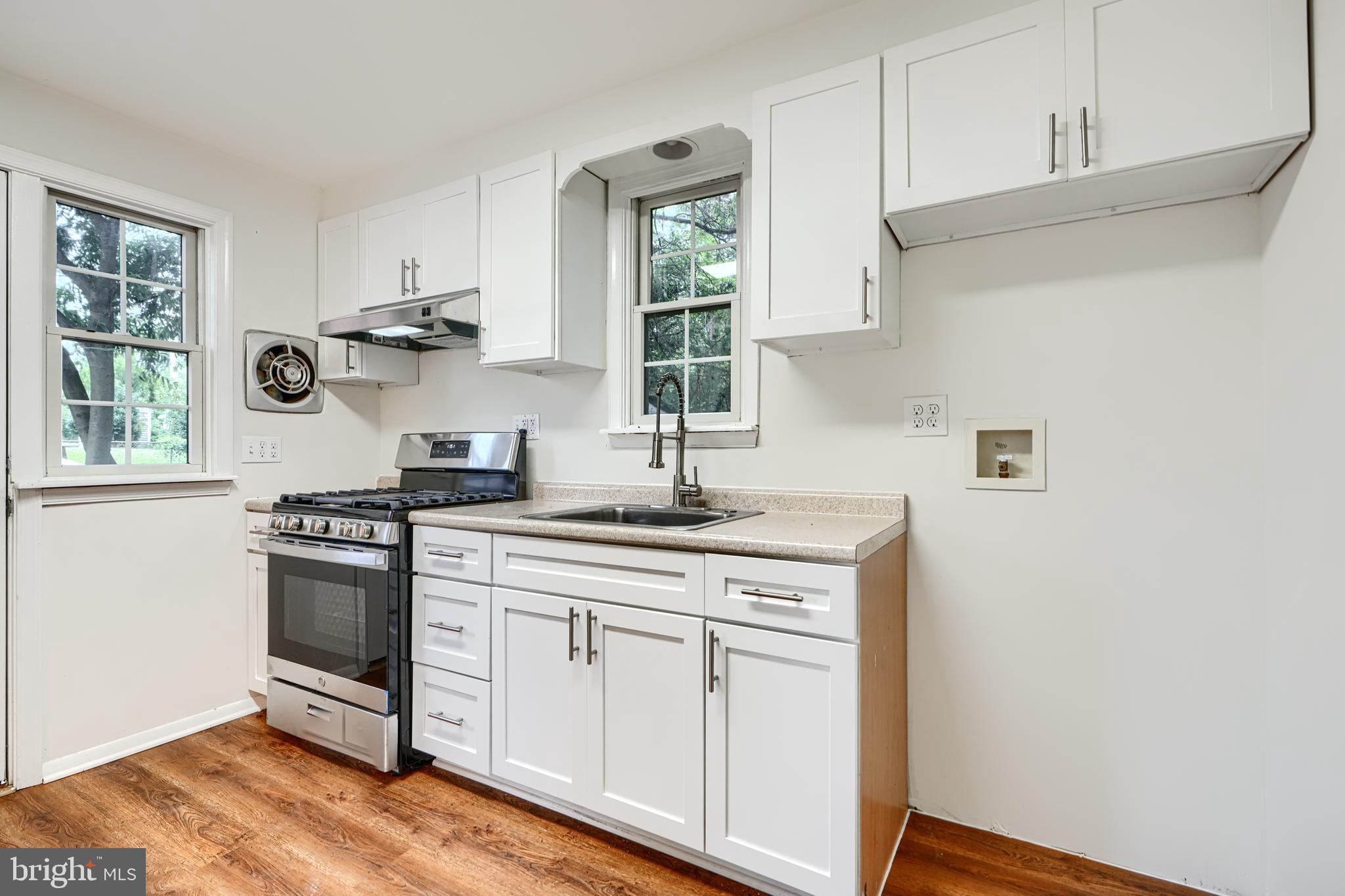 1813 Weyburn Road Baltimore, MD 21237 - Photo 12 of 39 a kitchen with stainless steel appliances granite countertop a sink and a stove