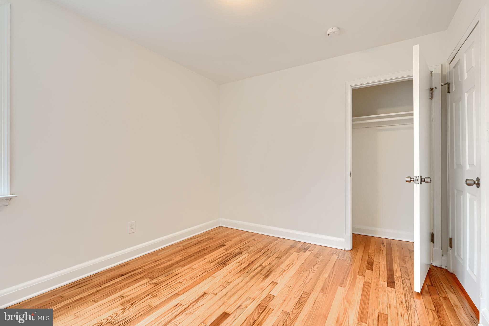 1813 Weyburn Road Baltimore, MD 21237 - Photo 16 of 39 a view of empty room with wooden floor and fan