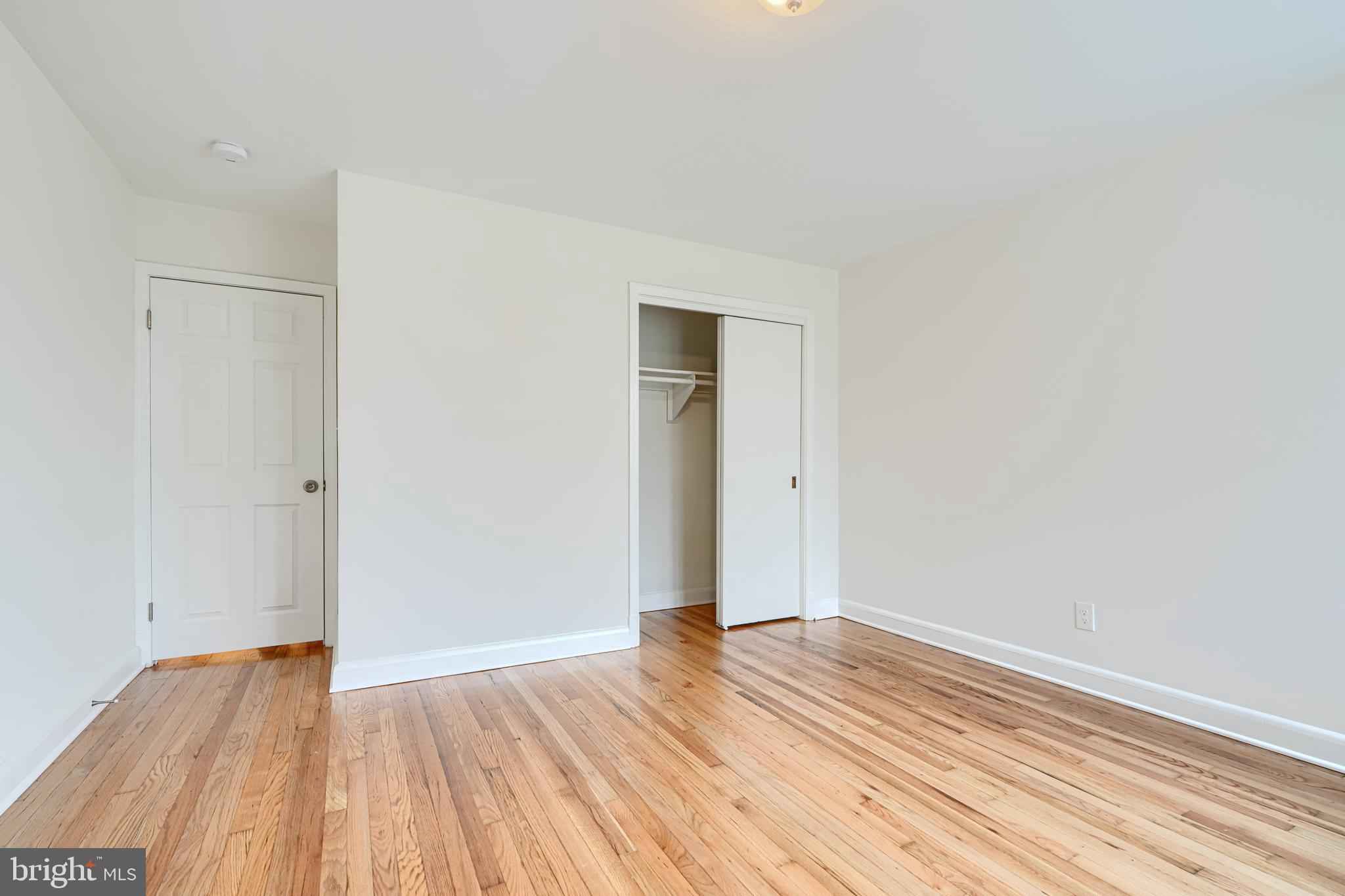 1813 Weyburn Road Baltimore, MD 21237 - Photo 20 of 39 a view of a room with wooden floor and white walls