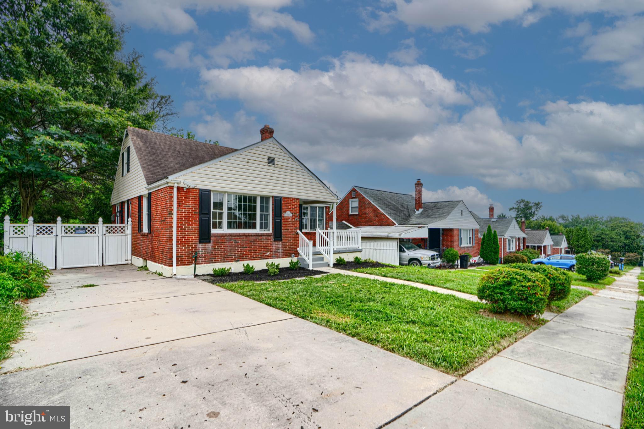 1813 Weyburn Road Baltimore, MD 21237 - Photo 2 of 39 a front view of a house with a yard