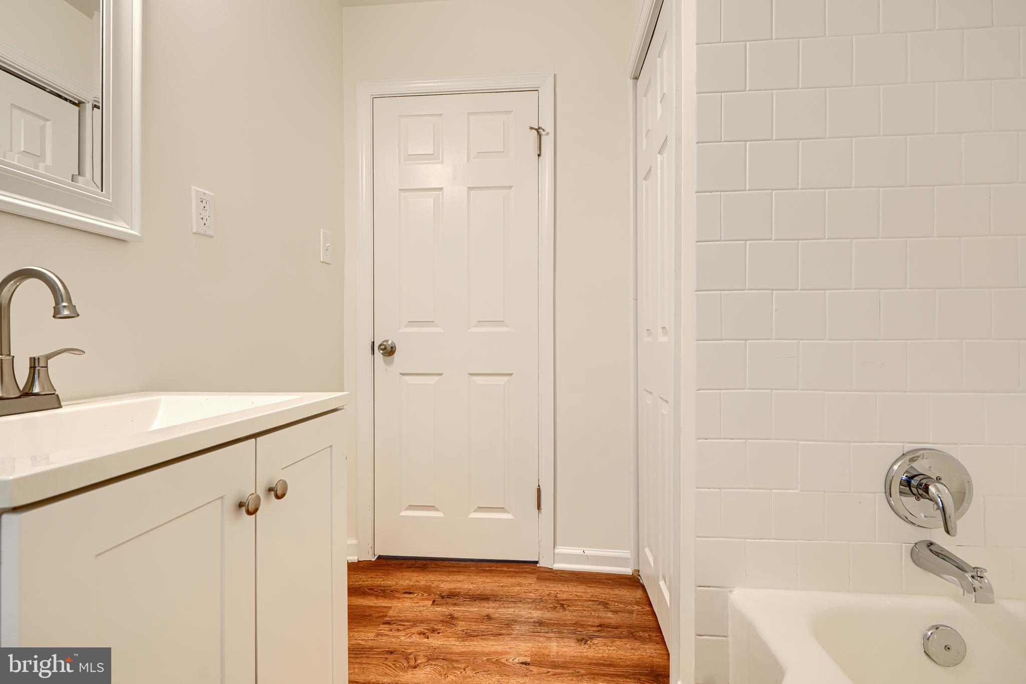 1813 Weyburn Road Baltimore, MD 21237 - Photo 23 of 39 a bathroom with a sink and shower