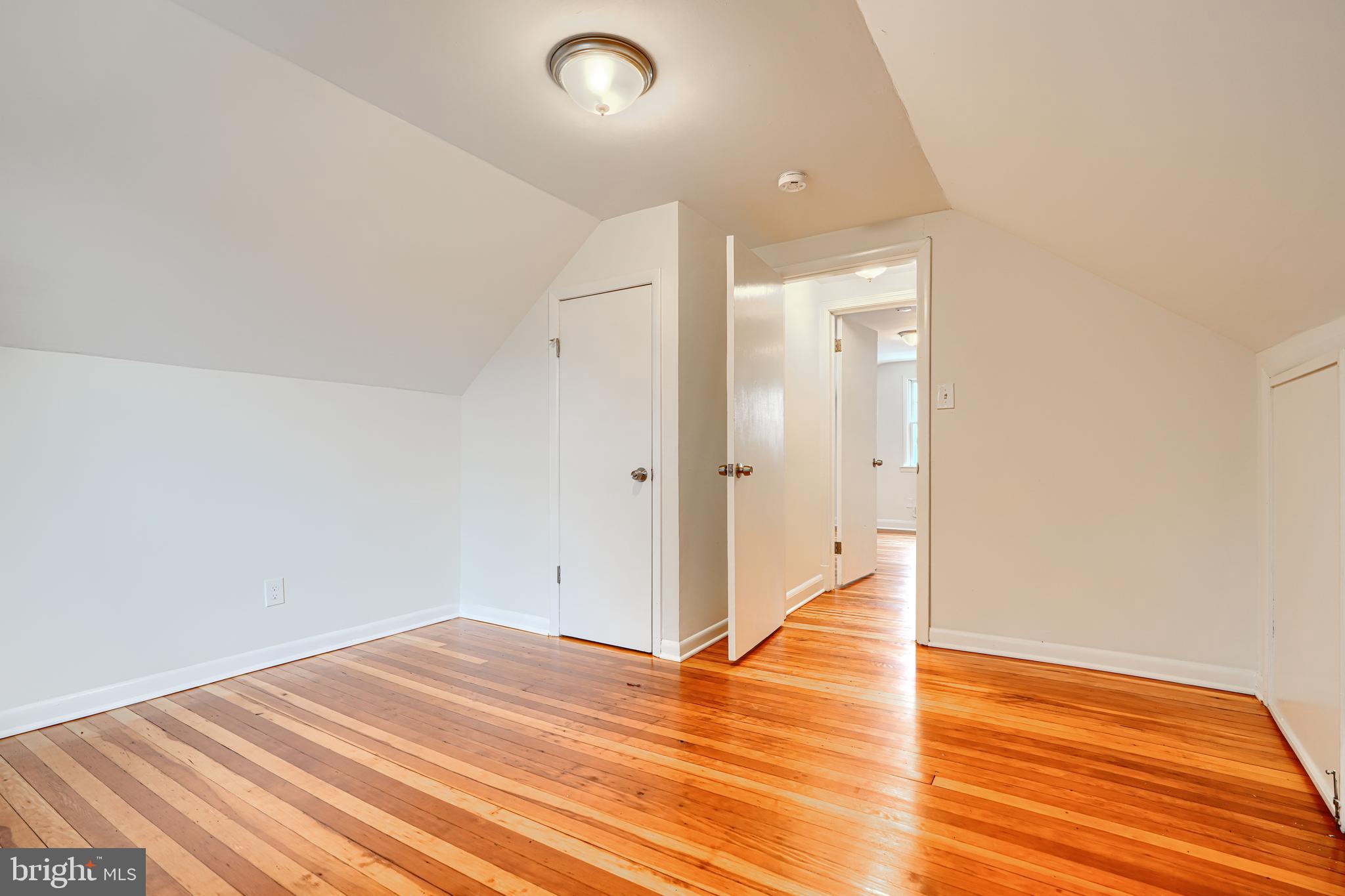 1813 Weyburn Road Baltimore, MD 21237 - Photo 25 of 39 wooden floor in an empty room