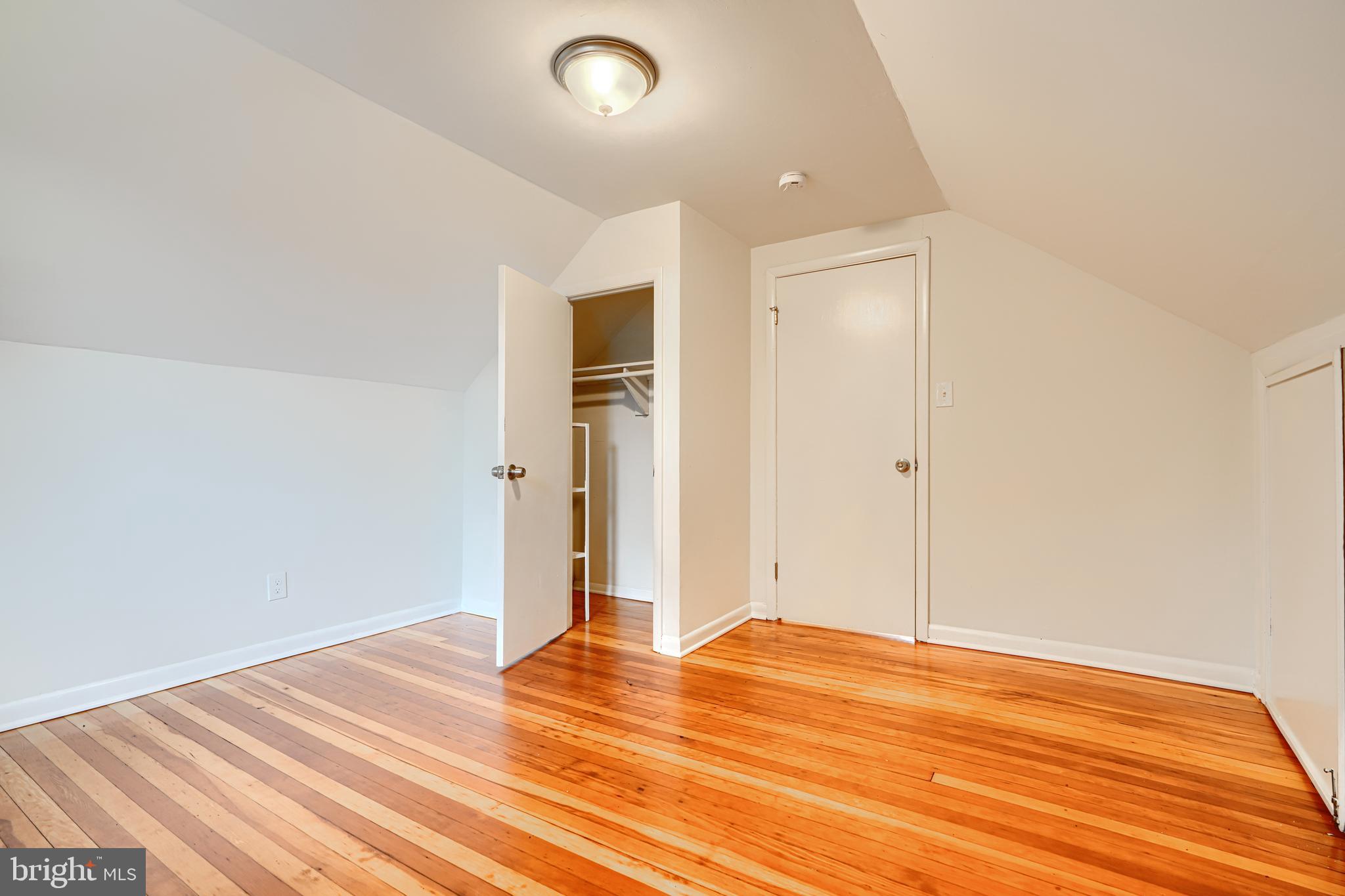 1813 Weyburn Road Baltimore, MD 21237 - Photo 26 of 39 a view of empty room with wooden floor