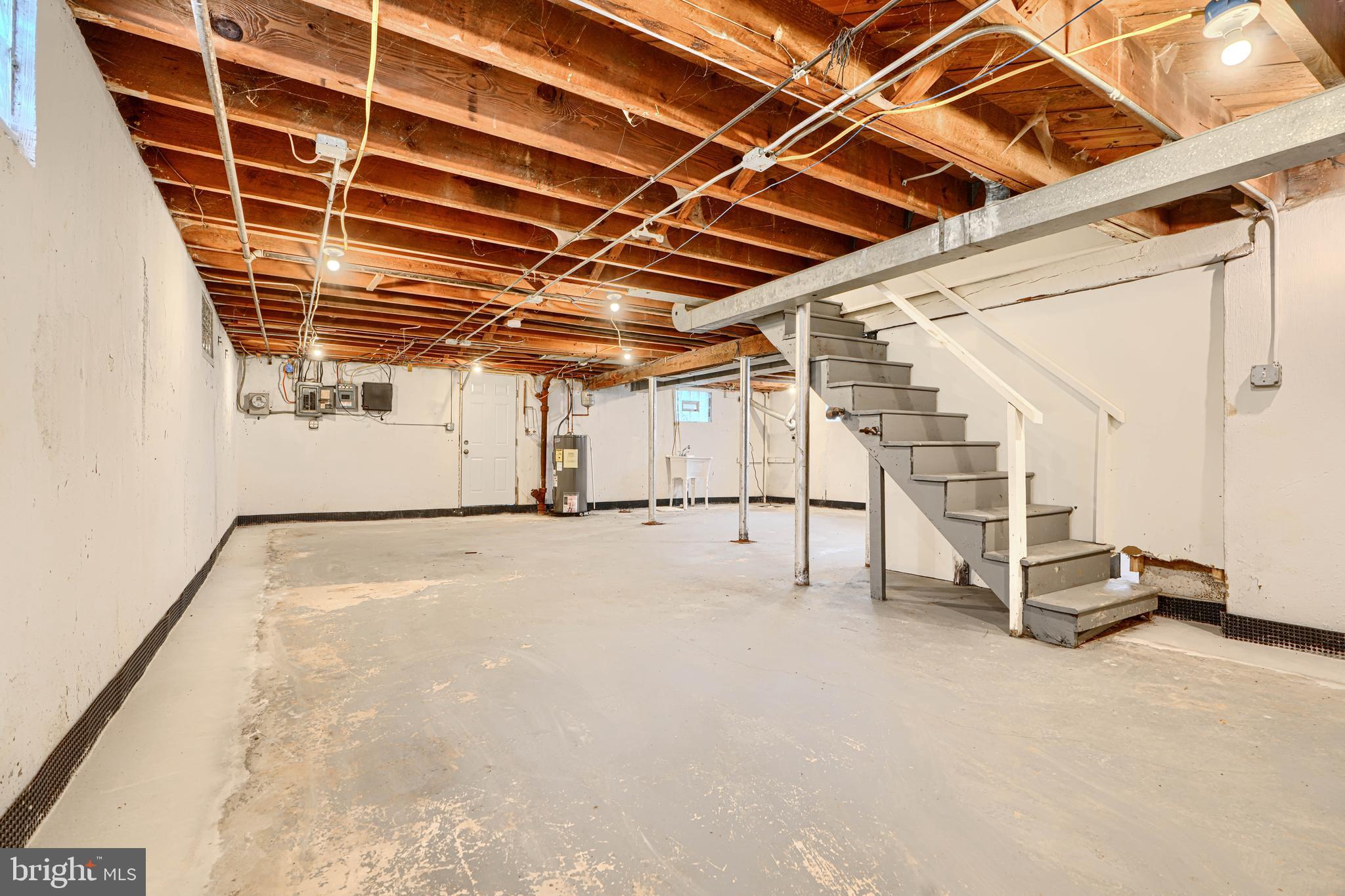 1813 Weyburn Road Baltimore, MD 21237 - Photo 30 of 39 a view of an empty room with wooden floor