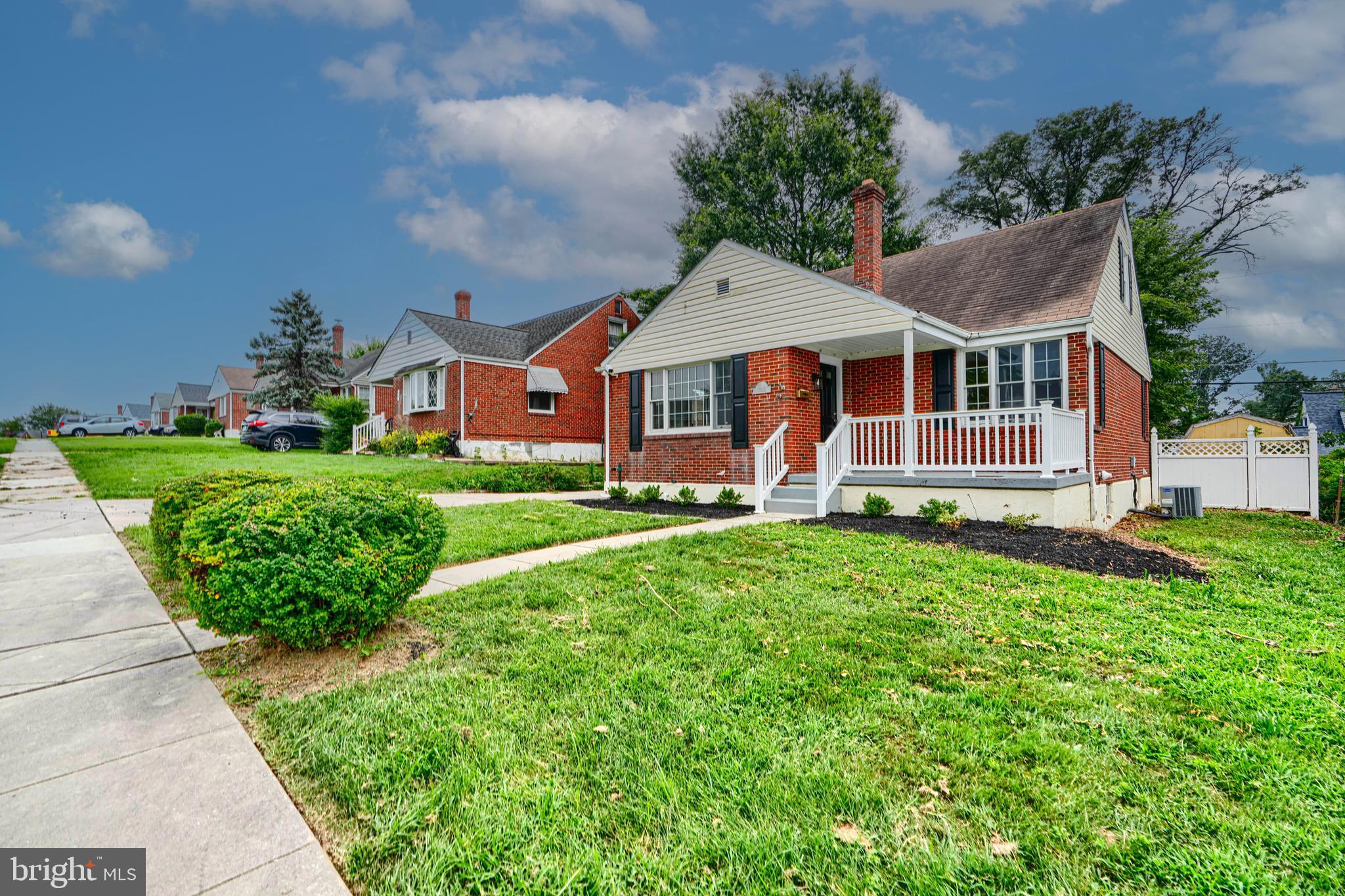 1813 Weyburn Road Baltimore, MD 21237 - Photo 3 of 39 a front view of a house with a yard
