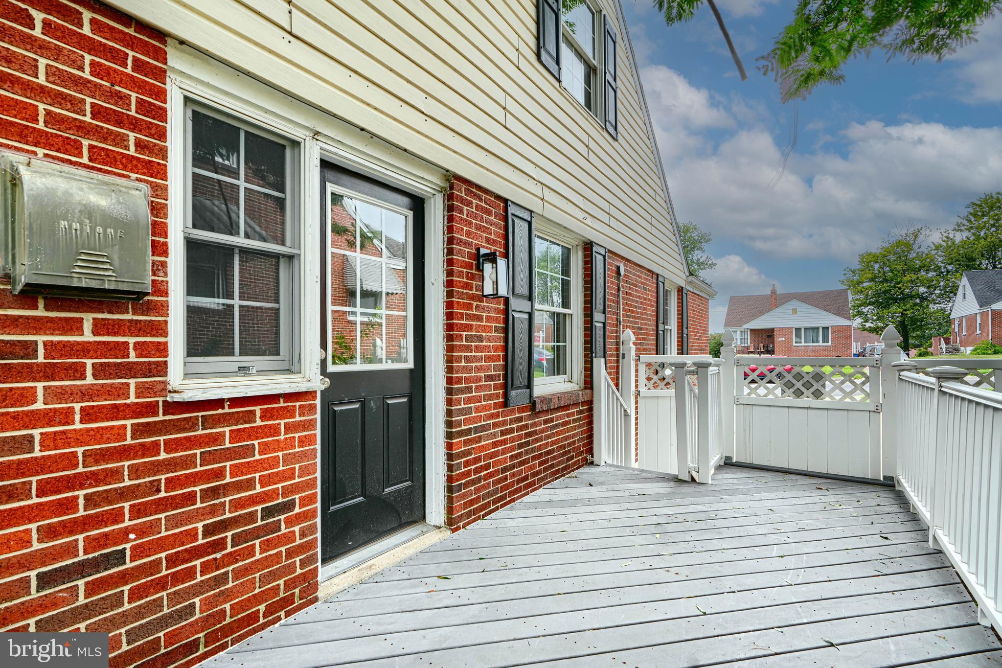 1813 Weyburn Road Baltimore, MD 21237 - Photo 35 of 39 a view of a house with a barbeque and wooden stairs