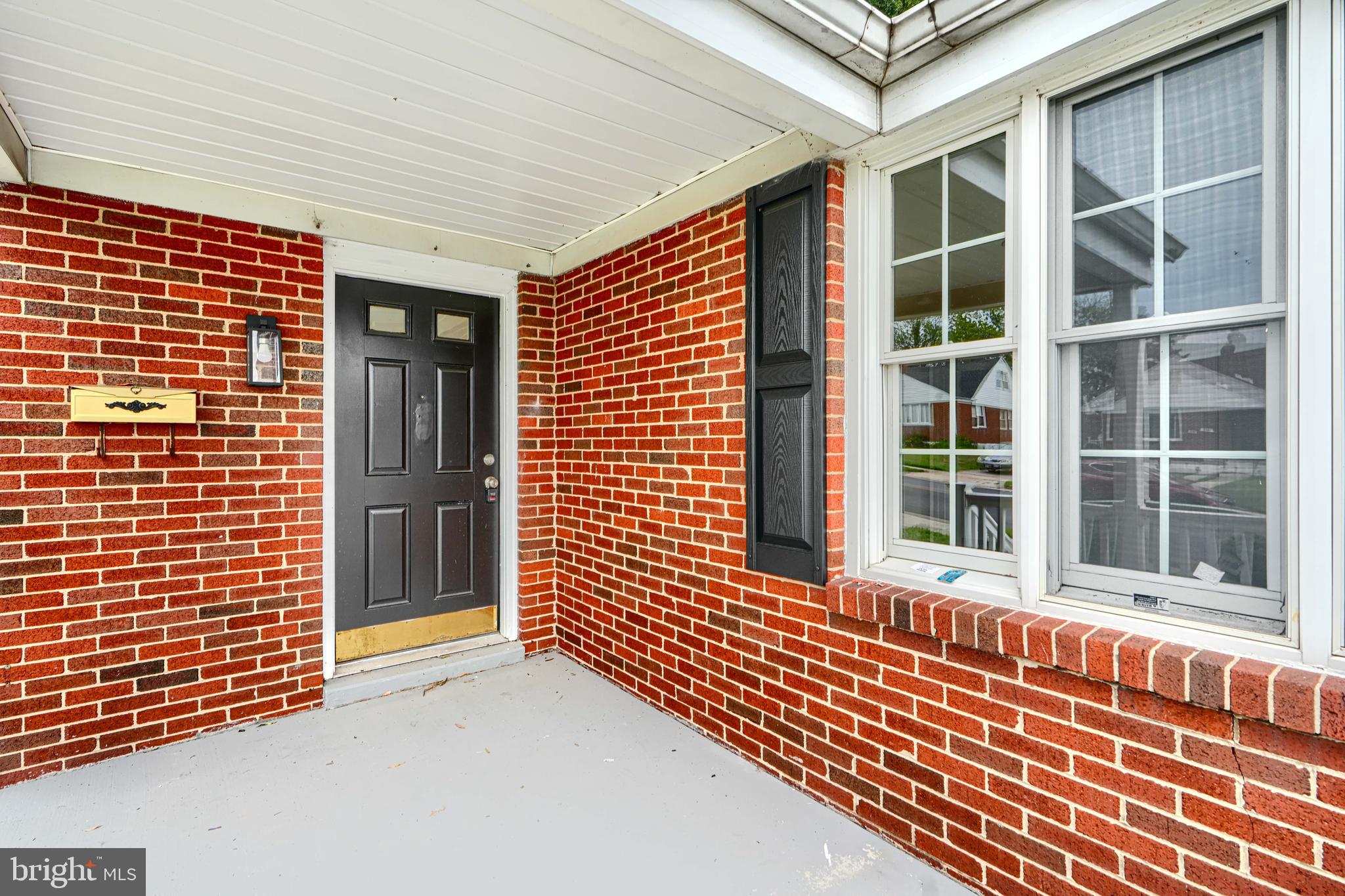 1813 Weyburn Road Baltimore, MD 21237 - Photo 4 of 39 a view of a brick house with large windows