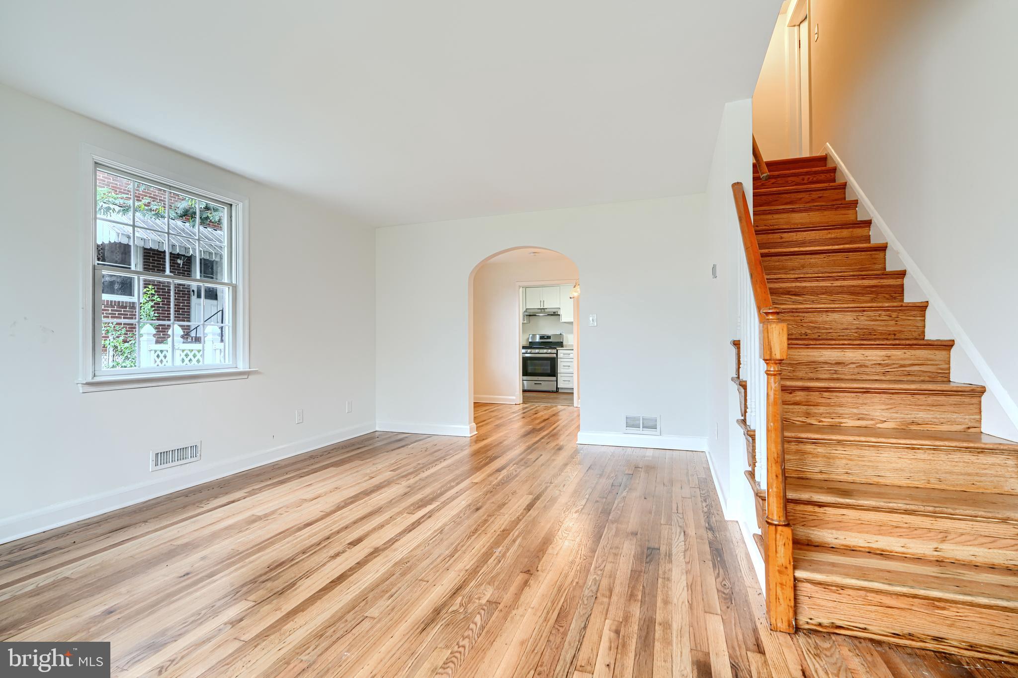 1813 Weyburn Road Baltimore, MD 21237 - Photo 6 of 39 a view of a room with wooden floor and white walls