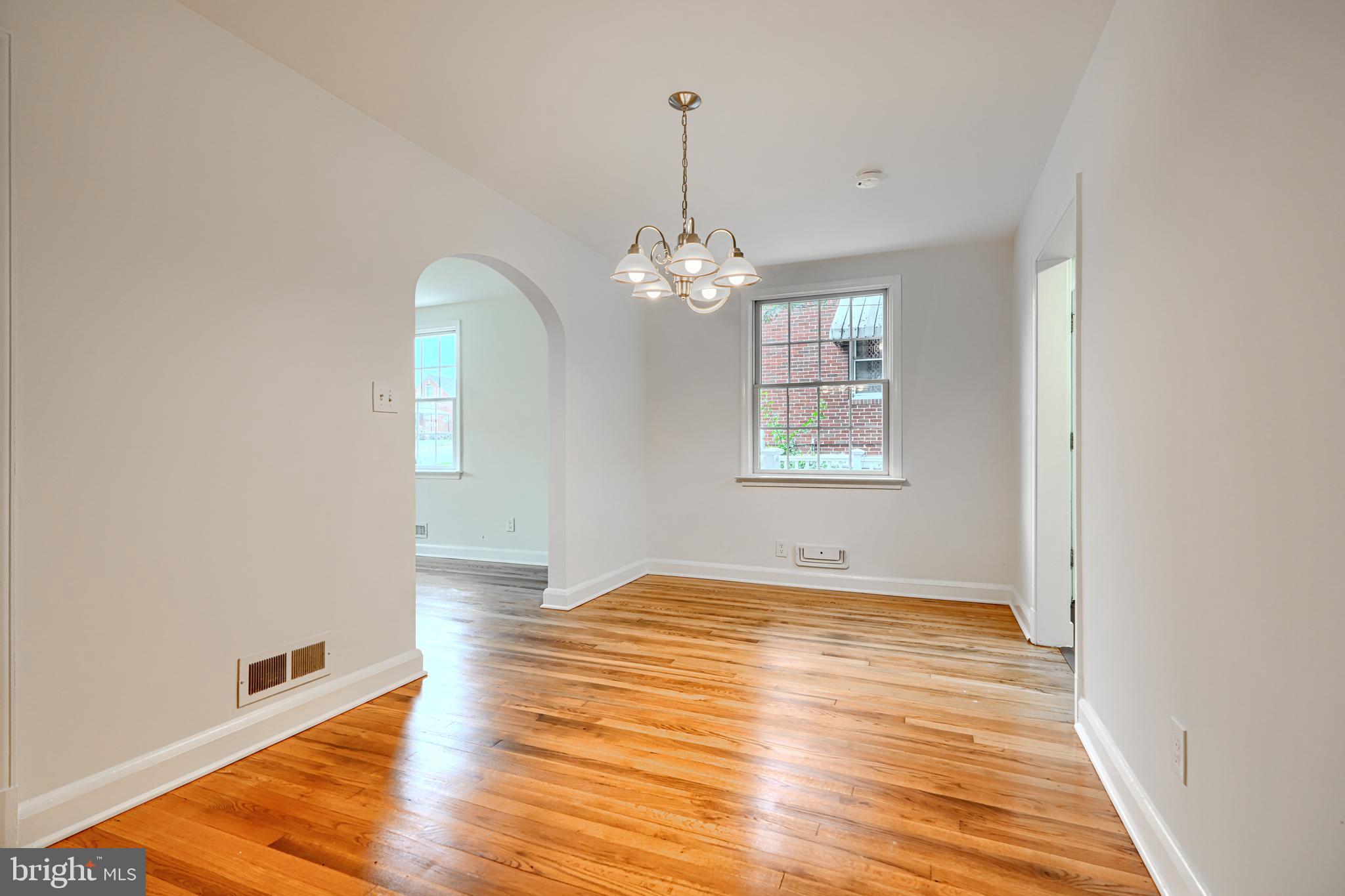 1813 Weyburn Road Baltimore, MD 21237 - Photo 8 of 39 wooden floor in an empty room with a window