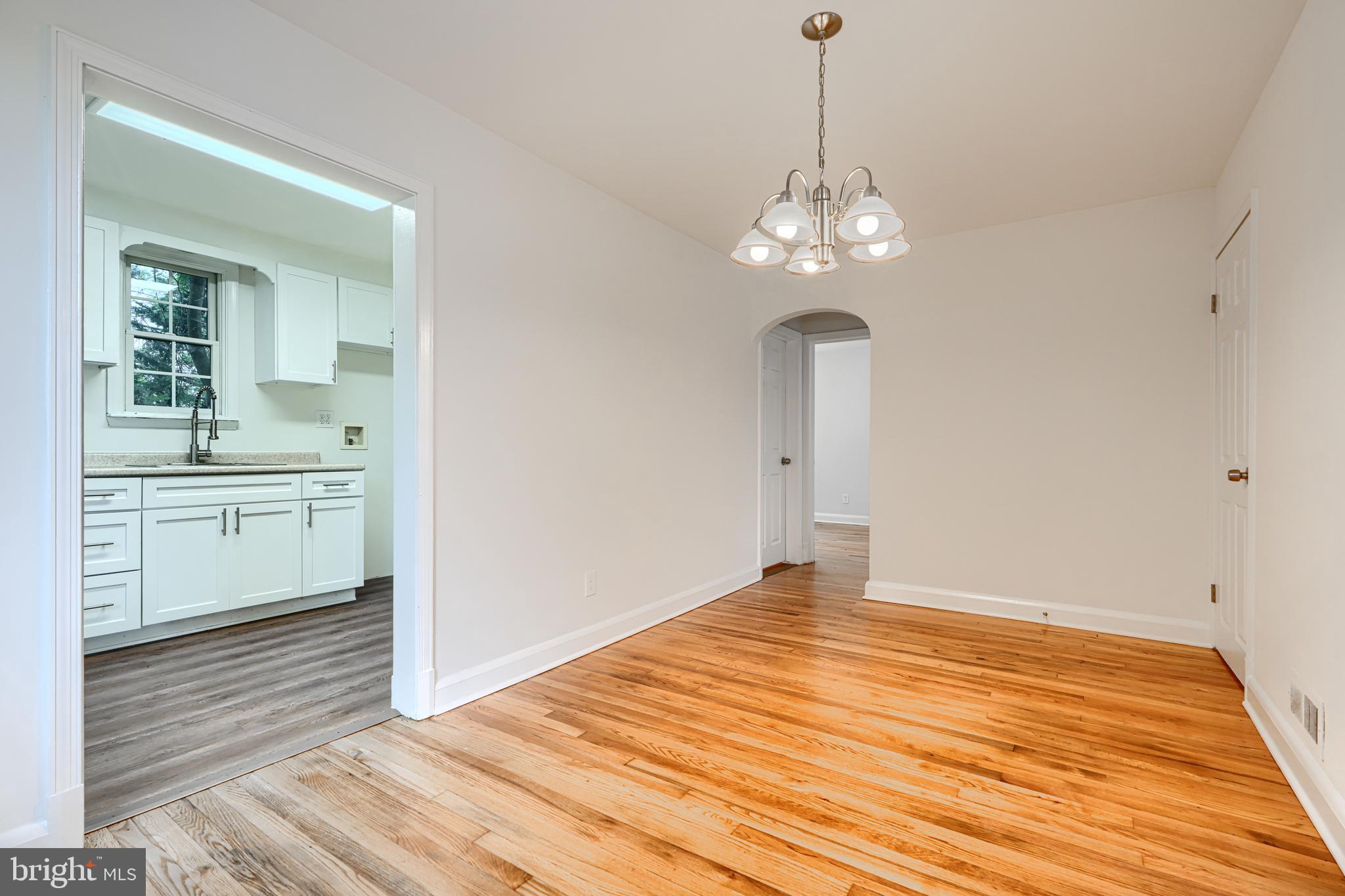 1813 Weyburn Road Baltimore, MD 21237 - Photo 9 of 39 a view of a room with wooden floor and sink