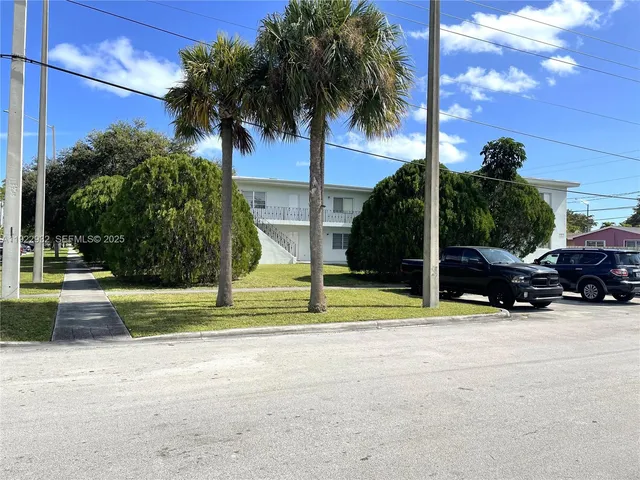 a view of street with parked cars