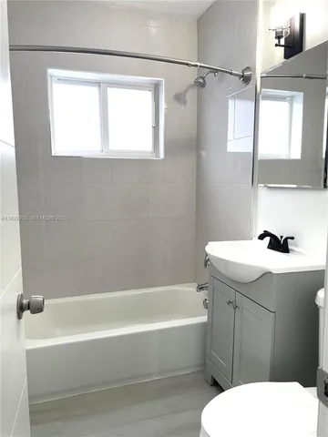 a bathroom with a sink a toilet and a bathtub