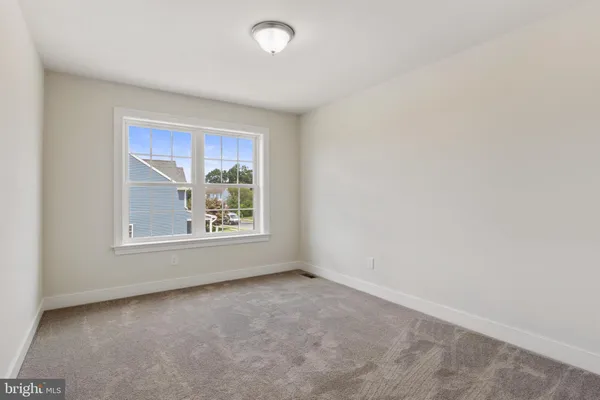 a view of an empty room with stairs