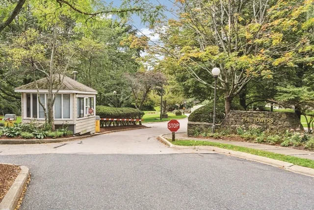 a view of a patio with table and chairs and a barbeque