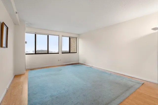 a bedroom with furniture and a dresser