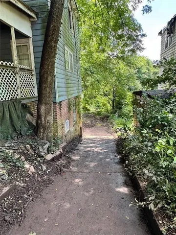 a backyard of a house with lots of green space