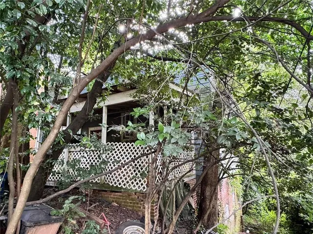a house view with a tree in the background
