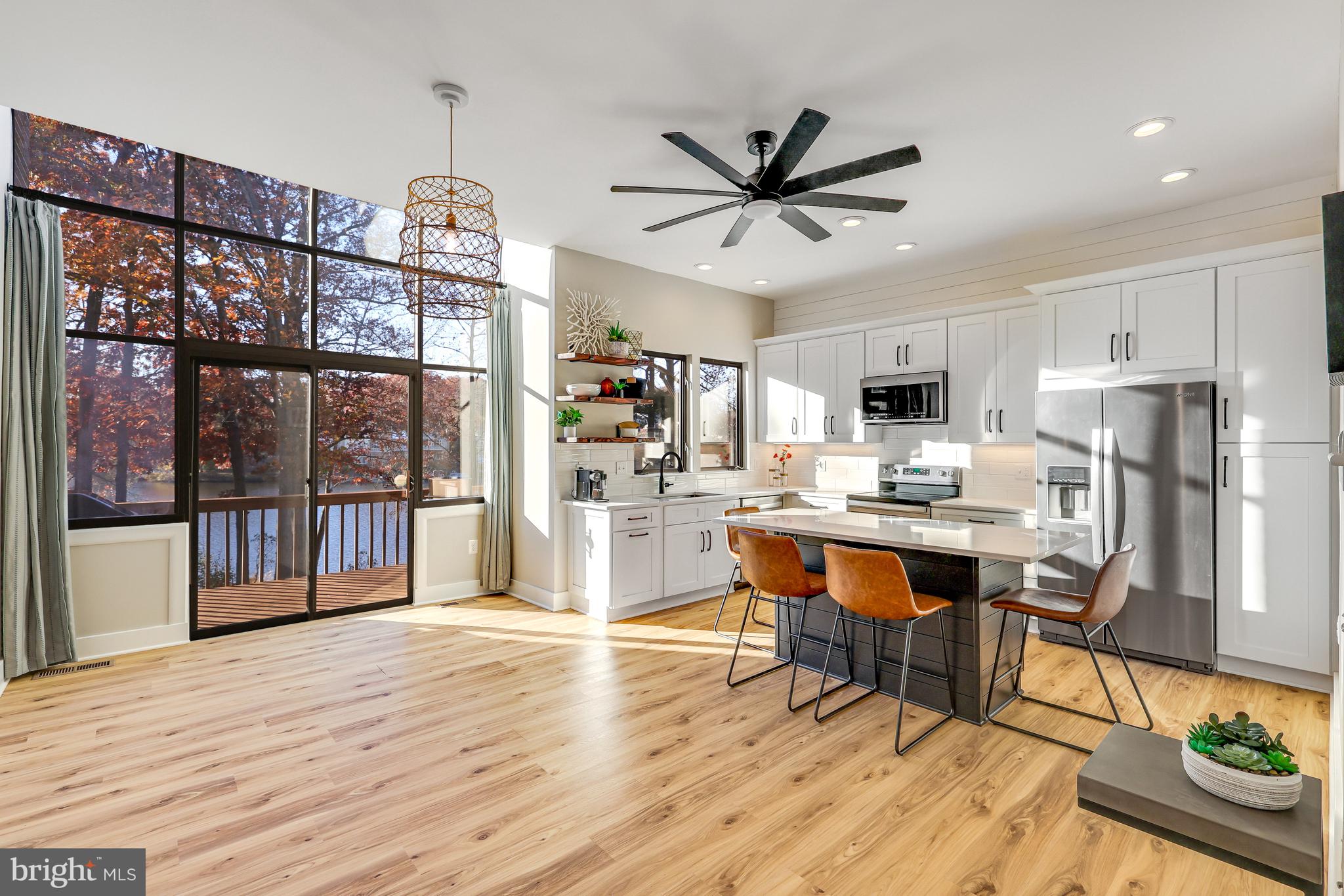 11010 Thrush Ridge Road Reston, VA 20191 - Photo 83 of 87 a living room with stainless steel appliances kitchen island granite countertop furniture wooden floor and a kitchen view