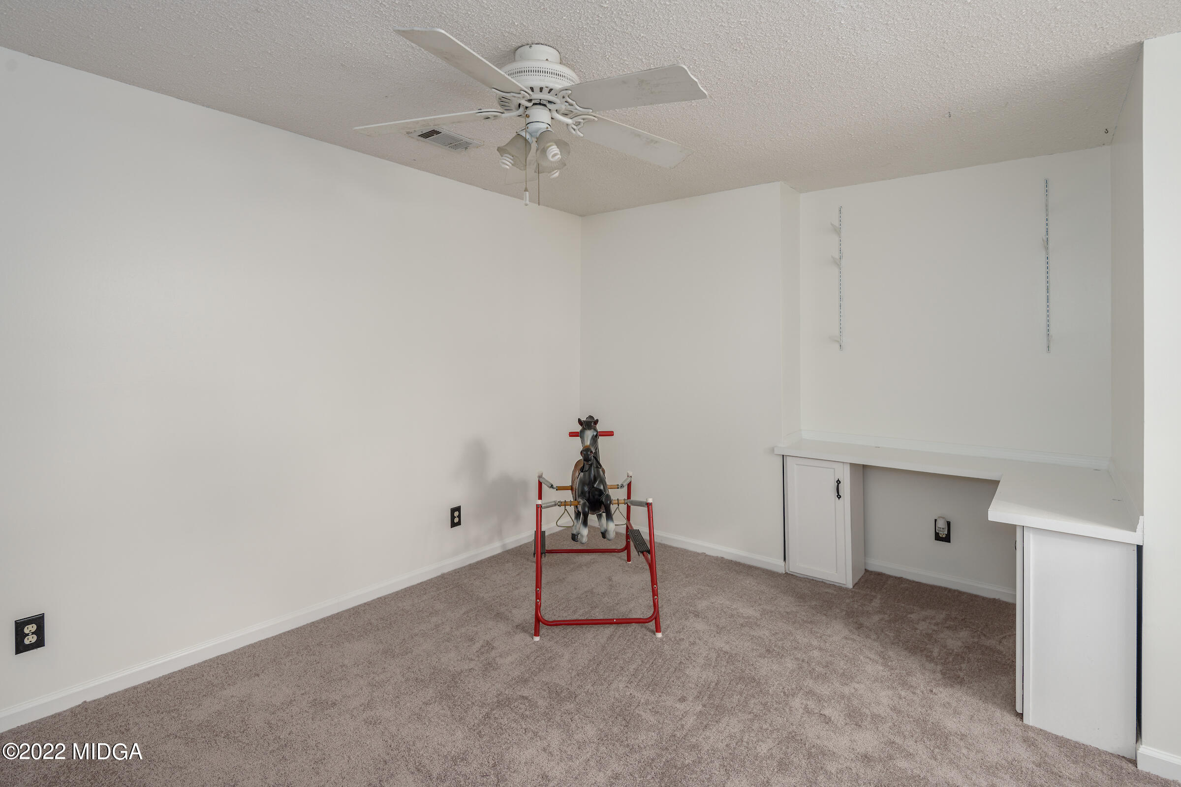1783 Pate Road Macon, GA 31210 - Photo 24 of 27 a room with a chandelier fan and wooden floor