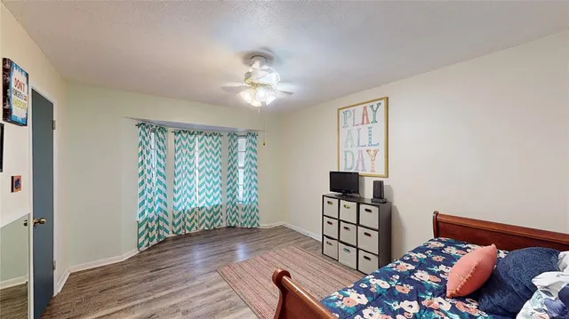 a bedroom with furniture and a window