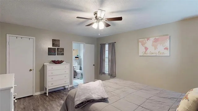 a bedroom with a bed and a cabinets