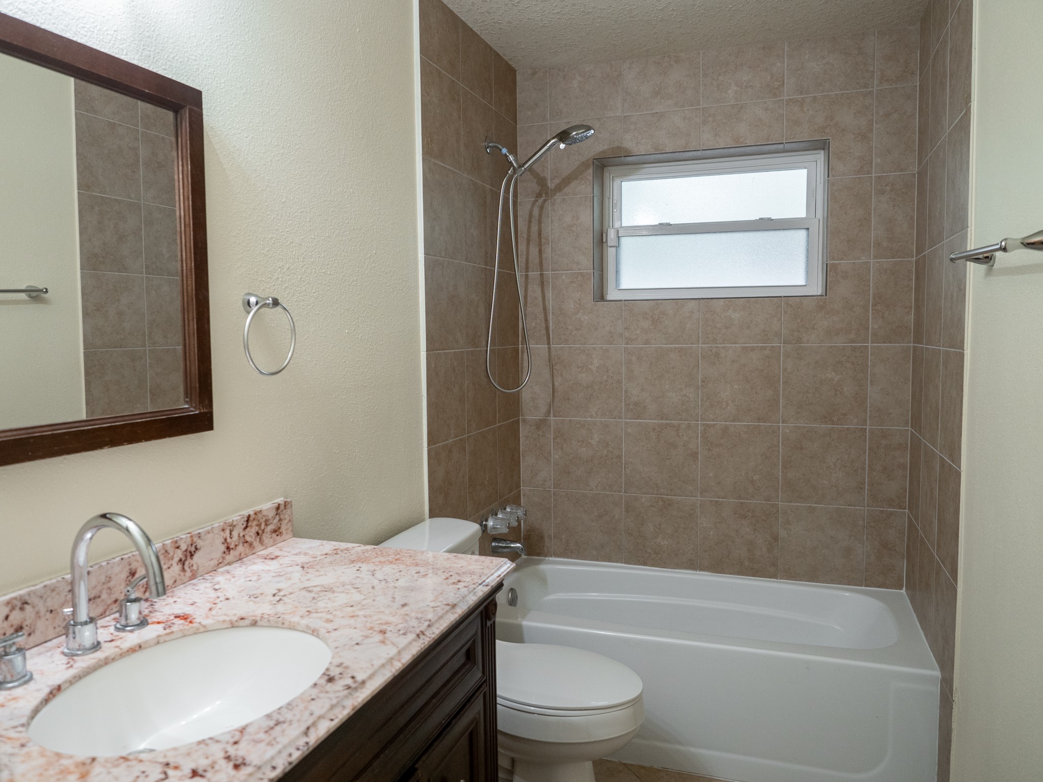 3302 Willie Way Spring, TX 77380 - Photo 14 of 25 a bathroom with a granite countertop sink toilet and shower