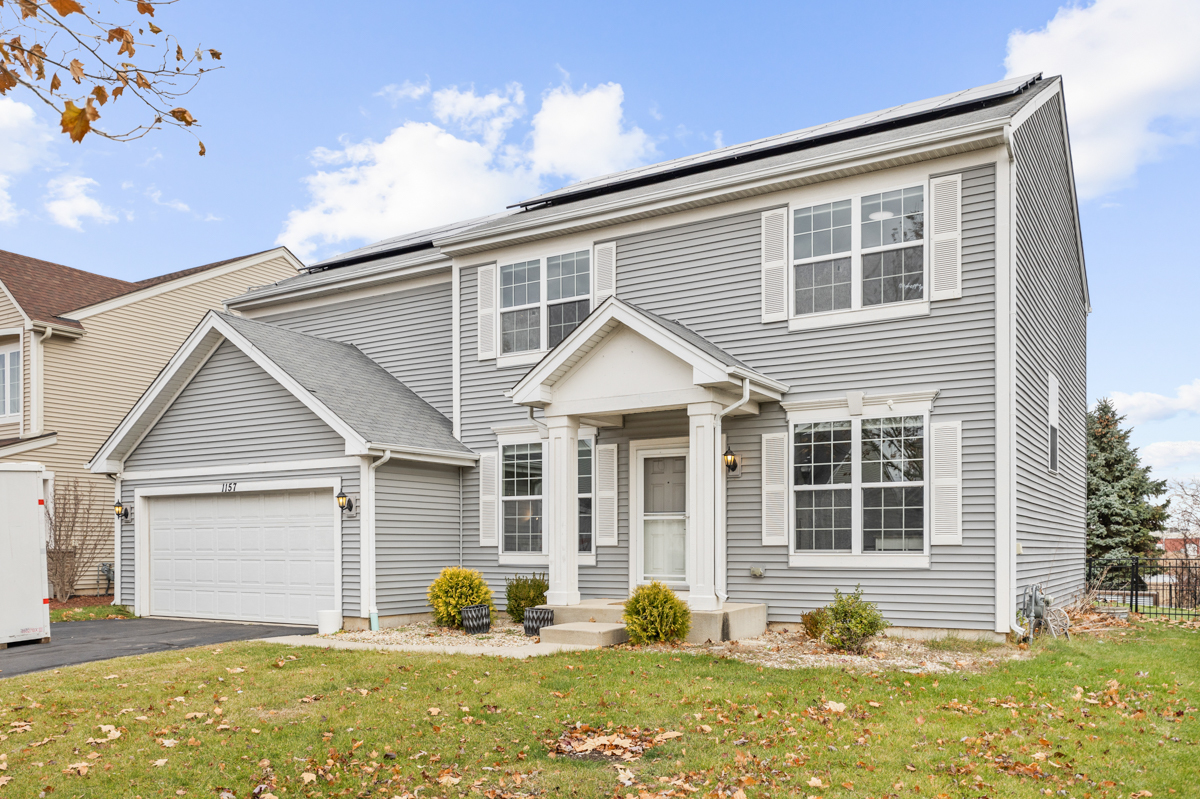 1157 Clearwater Drive Pingree Grove, IL 60140 - Photo 1 of 34 a front view of a house with yard