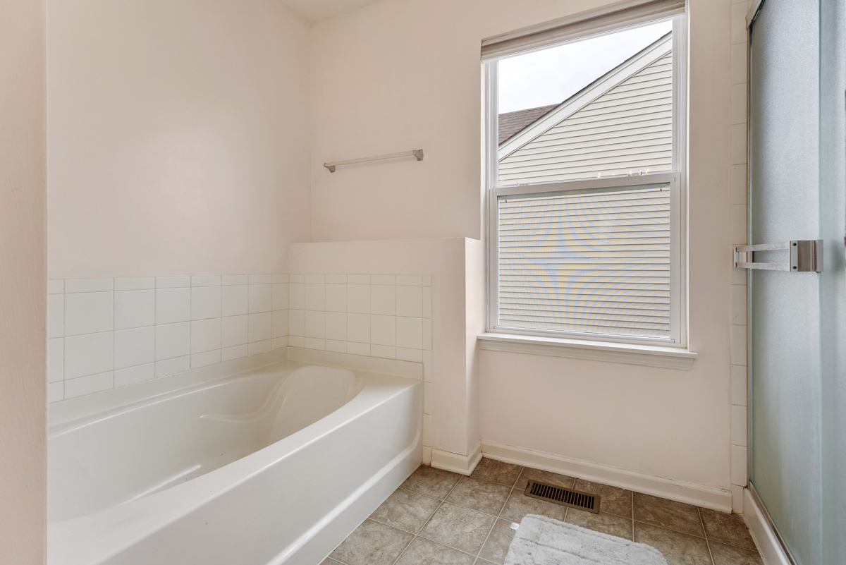 1157 Clearwater Drive Pingree Grove, IL 60140 - Photo 12 of 34 a white bath tub sitting next to a window