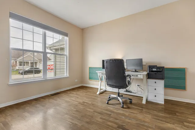 a workspace with furniture and a window