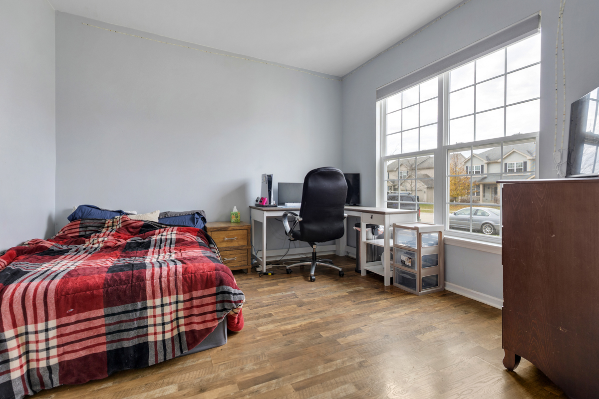 1157 Clearwater Drive Pingree Grove, IL 60140 - Photo 17 of 34 a bedroom with a bed and a large window