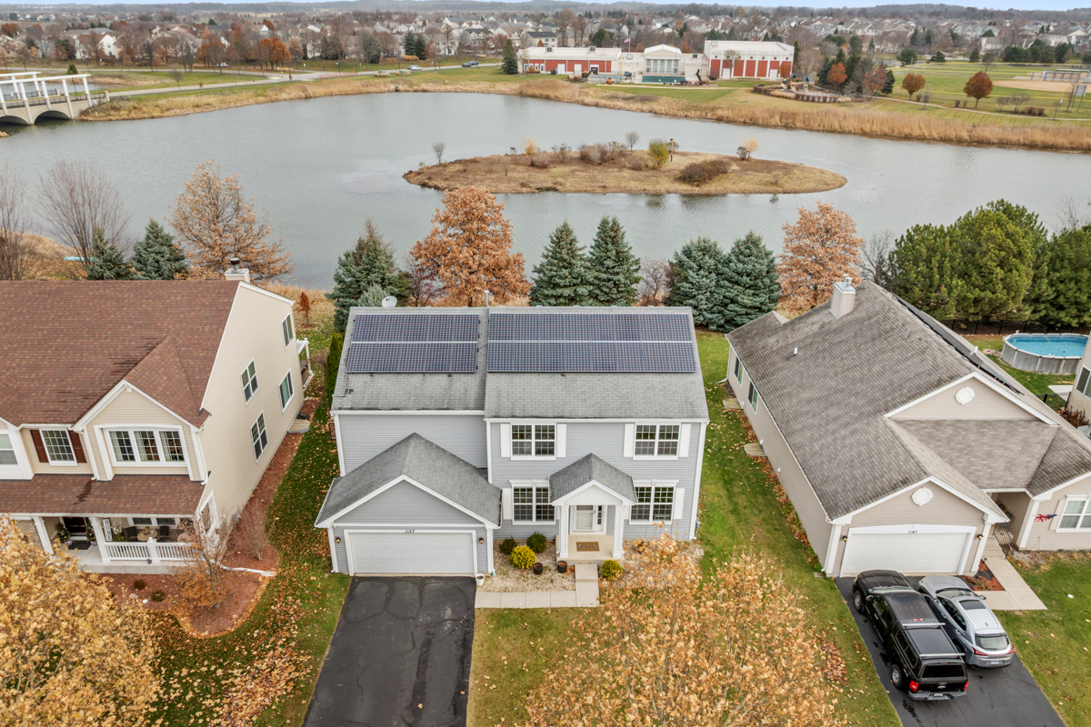 1157 Clearwater Drive Pingree Grove, IL 60140 - Photo 19 of 34 an aerial view of residential houses with outdoor space and lake view