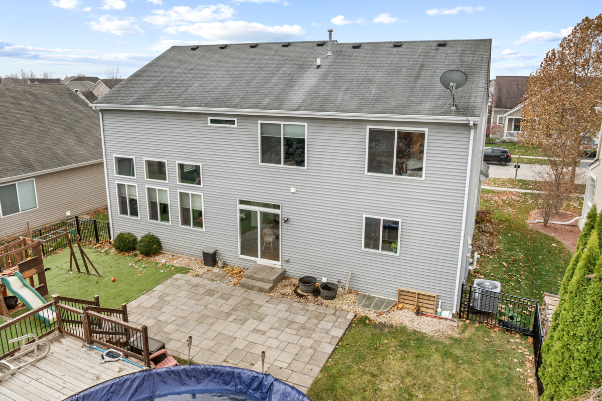 1157 Clearwater Drive Pingree Grove, IL 60140 - Photo 26 of 34 a view of a house with backyard and sitting area