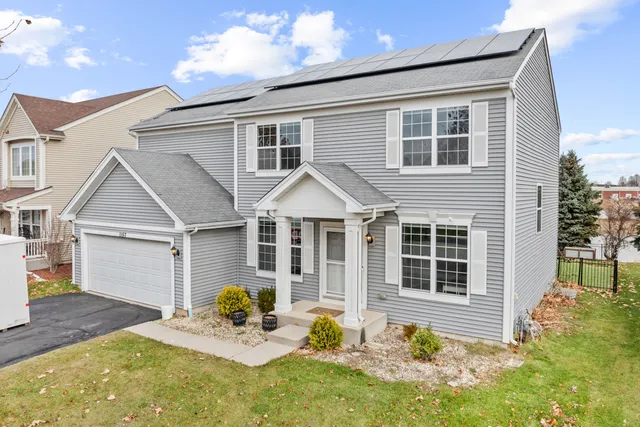 a kitchen with stainless steel appliances granite countertop a sink and cabinets