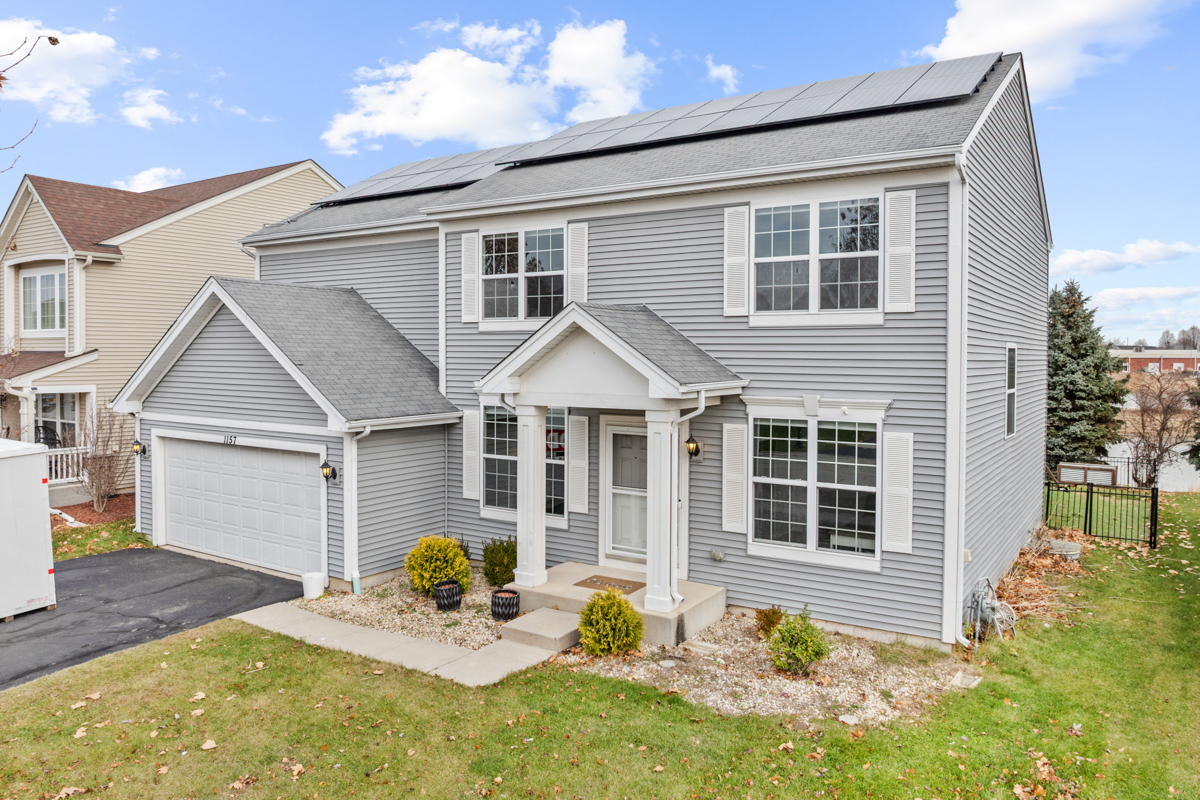 1157 Clearwater Drive Pingree Grove, IL 60140 - Photo 32 of 34 a backyard of a house with seating space
