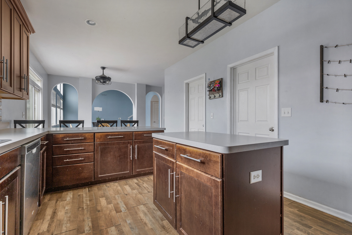 1157 Clearwater Drive Pingree Grove, IL 60140 - Photo 33 of 34 a kitchen with stainless steel appliances granite countertop a sink and cabinets