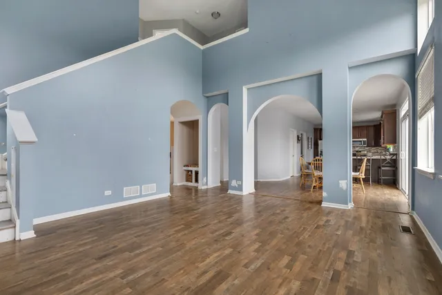 a view of an entryway with wooden floor