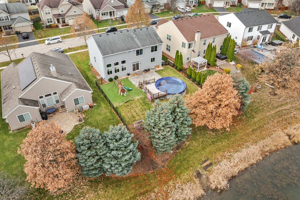 1157 Clearwater Drive Pingree Grove, IL 60140 - Photo 7 of 34 an aerial view of residential houses with outdoor space