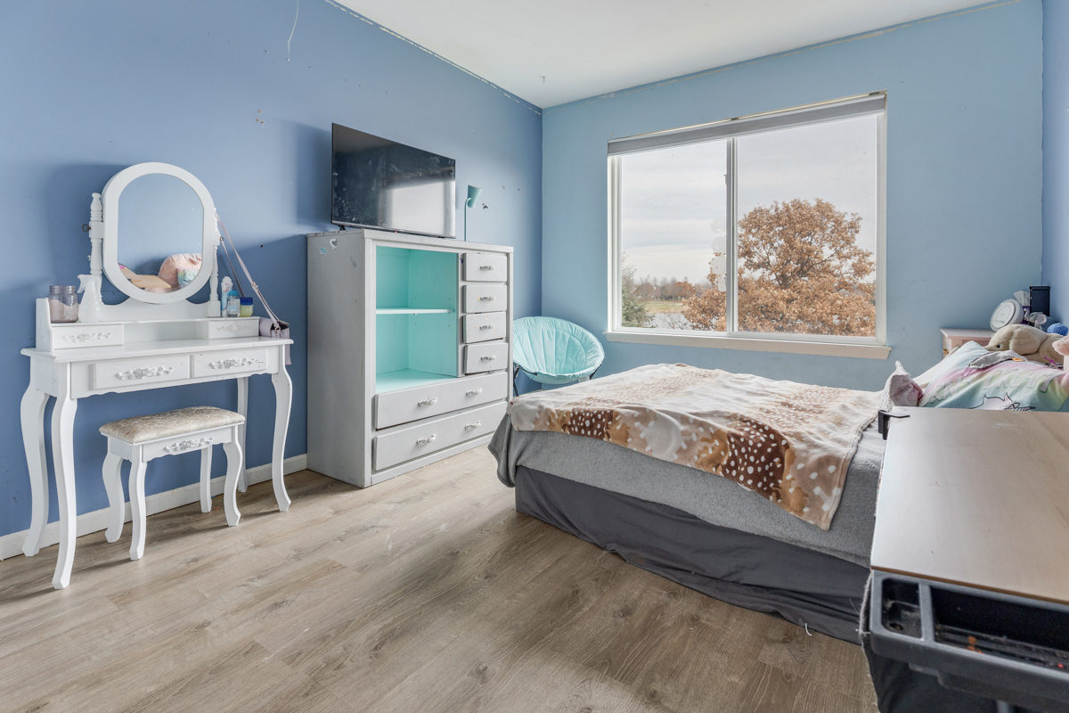 1157 Clearwater Drive Pingree Grove, IL 60140 - Photo 9 of 34 a bedroom with a bed a fireplace and a large window