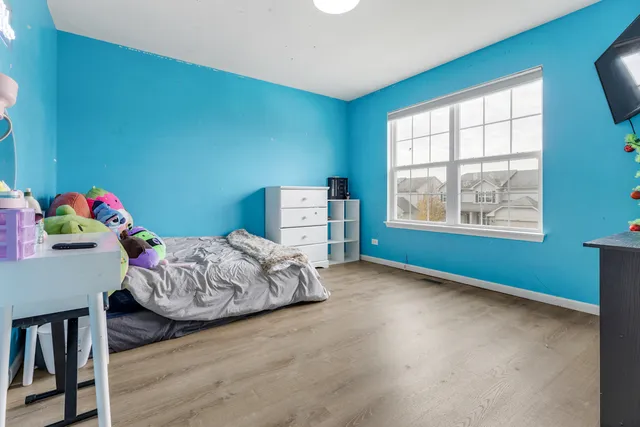 a bedroom with furniture and a window