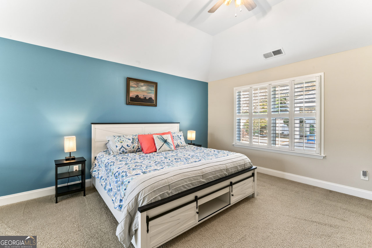 100 Cottage Club Drive Locust Grove, GA 30248 - Photo 17 of 42 a bedroom with a bed and a window