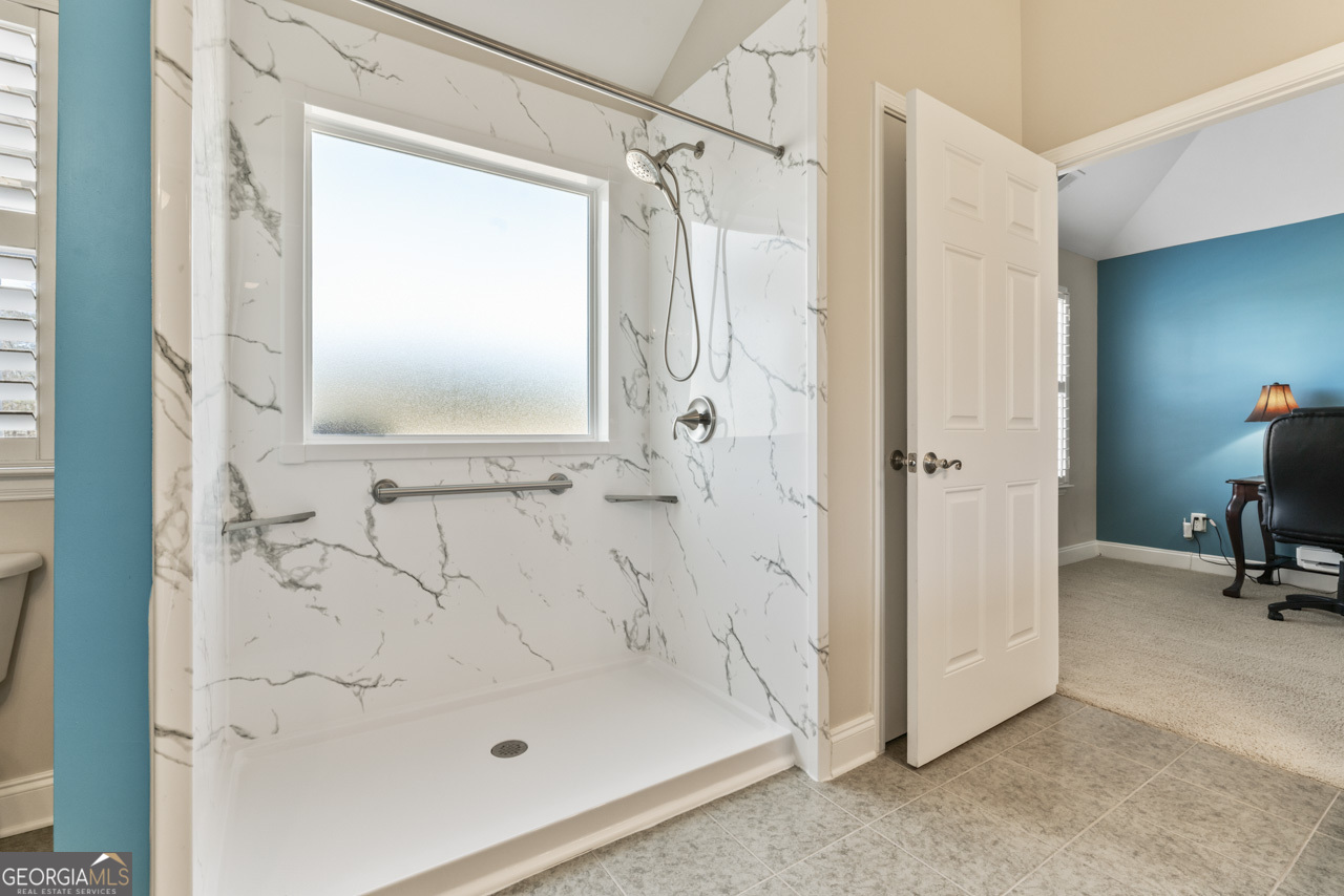 100 Cottage Club Drive Locust Grove, GA 30248 - Photo 19 of 42 a bathroom with a bath tub