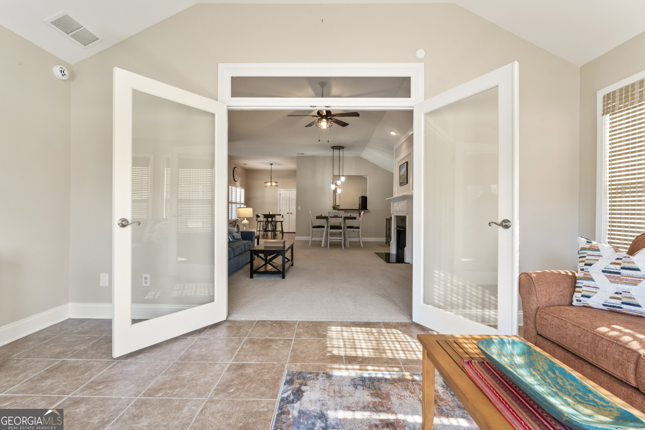 100 Cottage Club Drive Locust Grove, GA 30248 - Photo 25 of 42 a living room with furniture and a rug