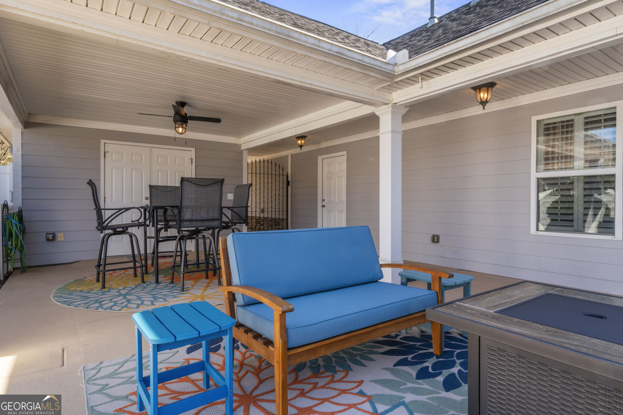 100 Cottage Club Drive Locust Grove, GA 30248 - Photo 29 of 42 a view of a livingroom with furniture and a table